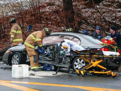 Emergency crews work to extricate a driver from their vehicle using the Jaws of Life after a two-car crash on the Mohawk Trail in Greenfield, on Sunday, Feb. 25, 2018.